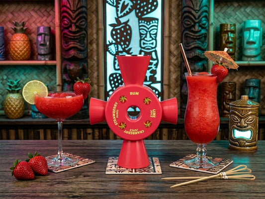 Strawberry Daiquiri Cocktail Jigger showing its pre-labelled measures for Rum, Lime Juice, Cranberry Juice and Strawberry Purée, on a tiki bar counter beside two frozen daiquiris